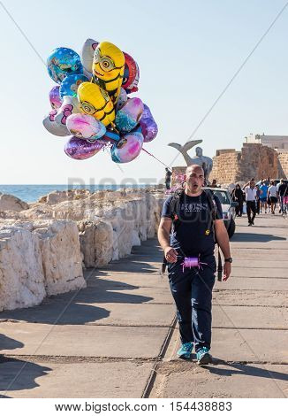 Street Vendor Sells Balloons And Beckoning Shoppers On The Waterfront
