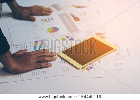 Business People Hands Working With A Tablet On White Table Background. Copy Space. Vintage Tone