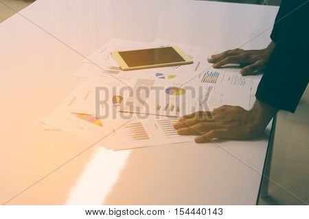 Business People Hands Working With A Tablet On White Table Background. Copy Space. Vintage Tone
