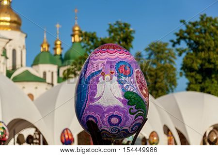 Kyiv Ukraine Sophia Square - 2 May 2016. Easter exhibition. Close up shot of the amazing Easter egg with image of an angel on the violet pattern KyivSophia square.