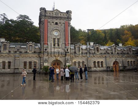Massandra, Russia - November 09, 2015: People on excursion through the territory the wine factory 