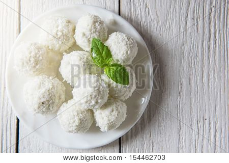 Homemade coconut candies with filling of cream and nut