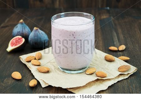 Honey almond fig smoothie. Healthy autumn fall smoothie on wooden background horizontal selective focus