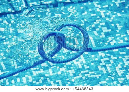 Pool cleaning pipe floating in private pool