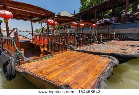 ZHUJIAJIAO CHINA - AUGUST 30 2016: Chinese gondolas waits Tourists on canal of ancient water town with a history of more than 1700 years in Zhujiajiao China on August 30 2016.