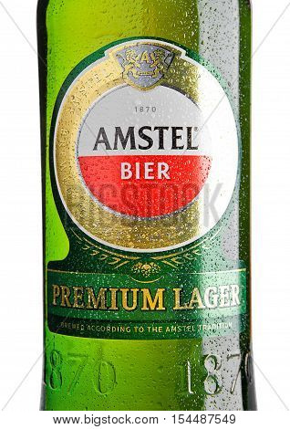 LONDON UNITED KINGDOM - NOVEMBER 01 2016: Cold bottle of Amstel Premium Lager on white background.Amstel is an internationally known brand of beer produced by Heineken International in Zoeterwoude Netherlands.