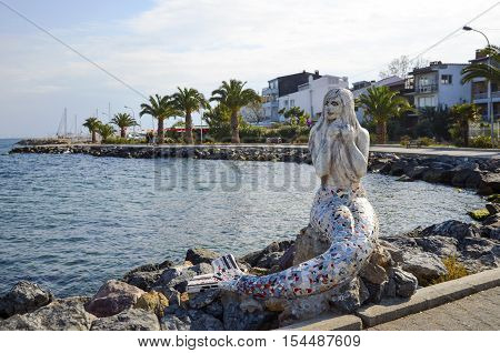 Istanbul Turkey - October 30 2016: Mermaid statue on the island of Buyukada One of the Prince Islands. by Painter Sculptors Feryal Taneri Mermaid statue made in 2014.