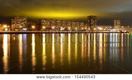 A view of the city at nightilluminated by bright lights.
