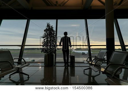 Traveler waiting for his flight in Airport