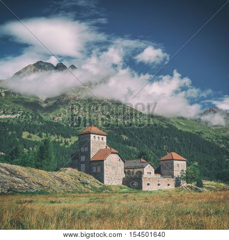 Amazing sunny day at Champferersee lake in the Swiss Alps. Castle of Crap da Sass, Silvaplana village, Switzerland, Europe. Toned like Instagram filter