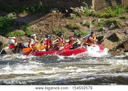 LOSEVO - AUGUST 18: Whitewater rafting on AUGUST 18 2012 RUSSIA. Unidentified persons enjoy whitewater rafting on the Vuoksi river in Losevo Leningrad region Russia