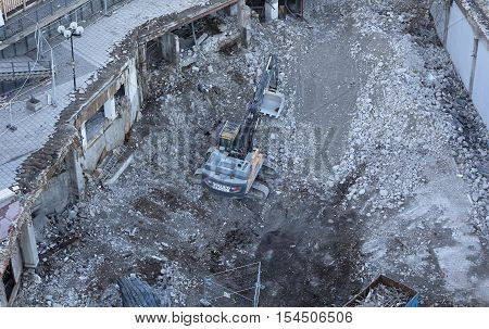 STOCKHOLM SWEDEN - OCT 30 2016: An excavator tear down the fameous area Slussen in central Stockholm preparing for the new buildings in October 30 2016 in Stockholm Sweden