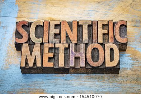 scientific method  - word abstract in vintage letterpress wood type printing blocks against grunge wood