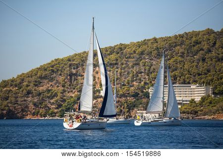 POROS, GREECE - SEP 29, 2016: Sailors participate in sailing regatta 16th Ellada Autumn 2016 among Greek island group in the Aegean Sea, in Cyclades and Saronic Gulf.