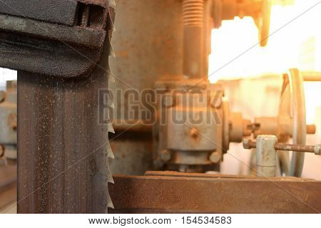 Close up blade of bandsaw. Sunshine effect