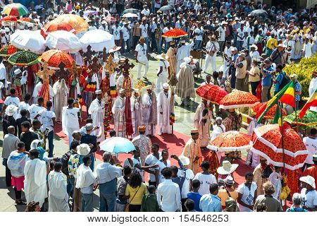 Gondar Ethiopia - January 19 2016: A crowd of faithful and tourists surrounding a procession in the annual religious celebration of Timket (epiphany)
