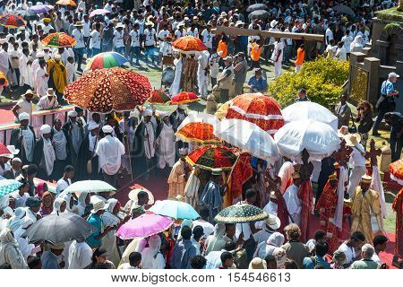 Gondar Ethiopia - January 19 2016: A crowd of faithful and tourists surrounding a procession in the annual religious celebration of Timket (epiphany)
