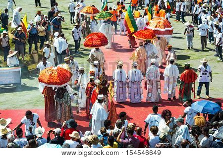 Gondar Ethiopia - January 19 2016: A crowd of faithful and tourists surrounding a procession in the annual religious celebration of Timket (epiphany)