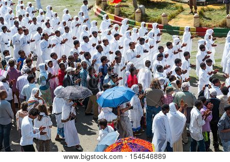 Gondar Ethiopia - January 19 2016: A crowd of faithful and tourists surrounding a procession in the annual religious celebration of Timket (epiphany)