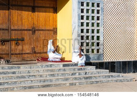 Axum Ethiopia - January 20 2016: Faithfuls sitting on the stairs of the modern church of Our Lady Mary of Sion