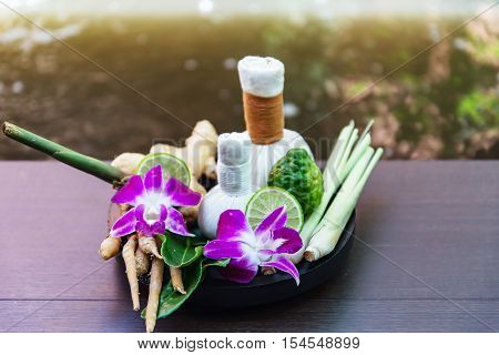 Spa massage compress balls herbal ball on the wooden with treaments spa Thailand select focus
