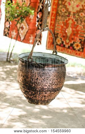 Selling old metal cookware in a market place