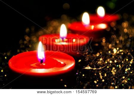 Advent decoration with four red candles and background
