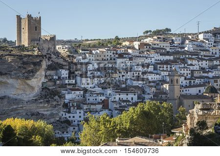 Alcala del Jucar Spain - October 29 2016: Panoramic view of the city on top of limestone mountain is situated Castle of the 12TH century Almohad origin take in Alcala of the Jucar Albacete province Spain