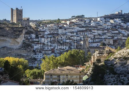 Alcala del Jucar Spain - October 29 2016: Panoramic view of the city on top of limestone mountain is situated Castle of the 12TH century Almohad origin take in Alcala of the Jucar Albacete province Spain