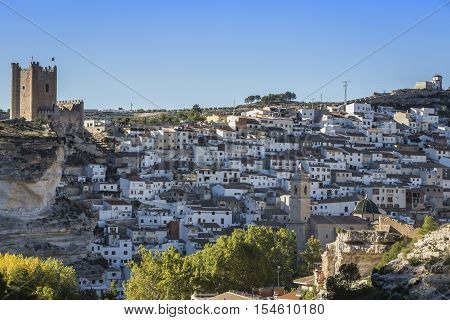 Alcala del Jucar Spain - October 29 2016: Panoramic view of the city on top of limestone mountain is situated Castle of the 12TH century Almohad origin take in Alcala of the Jucar Albacete province Spain
