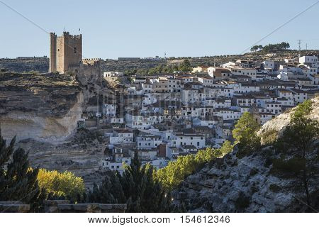 Alcala del Jucar Spain - October 29 2016: Panoramic view of the city on top of limestone mountain is situated Castle of the 12TH century Almohad origin take in Alcala of the Jucar Albacete province Spain