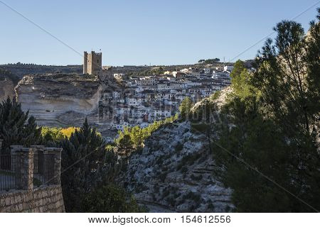 Alcala del Jucar Spain - October 29 2016: Panoramic view of the city on top of limestone mountain is situated Castle of the 12TH century Almohad origin take in Alcala of the Jucar Albacete province Spain