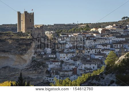 Alcala del Jucar Spain - October 29 2016: Panoramic view of the city on top of limestone mountain is situated Castle of the 12TH century Almohad origin take in Alcala of the Jucar Albacete province Spain