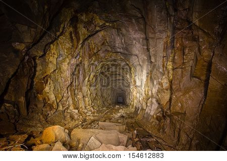 Abandoned old mine gold ore shaft tunnel passage rails