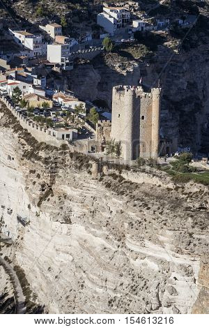 Alcala del Jucar Spain - October 29 2016: Panoramic view of the city on top of limestone mountain is situated Castle of the 12TH century Almohad origin take in Alcala of the Jucar Albacete province Spain