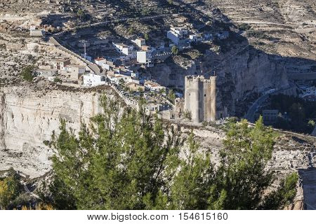 Alcala del Jucar Spain - October 29 2016: Panoramic view of the city on top of limestone mountain is situated Castle of the 12TH century Almohad origin take in Alcala of the Jucar Albacete province Spain