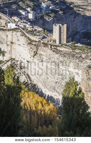 Alcala del Jucar Spain - October 29 2016: Panoramic view of the city on top of limestone mountain is situated Castle of the 12TH century Almohad origin take in Alcala of the Jucar Albacete province Spain