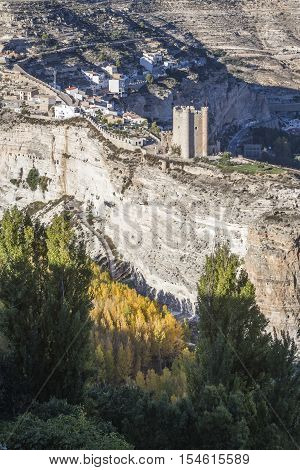 Alcala del Jucar Spain - October 29 2016: Panoramic view of the city on top of limestone mountain is situated Castle of the 12TH century Almohad origin take in Alcala of the Jucar Albacete province Spain