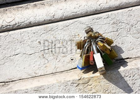 several old padlock on an old wooden door