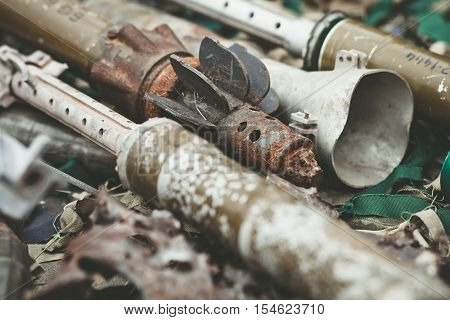 remnants of shells anti-tank rocket propelled grenade launcher and High Mobility Artillery Rocket System