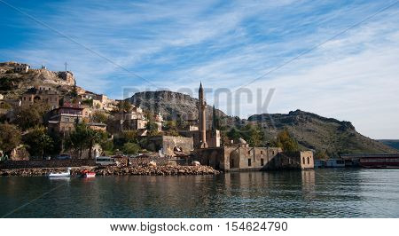 Gaziantep, Turkey - December 08, 2014: Minaret of the mosque in the water in village near Halfeti