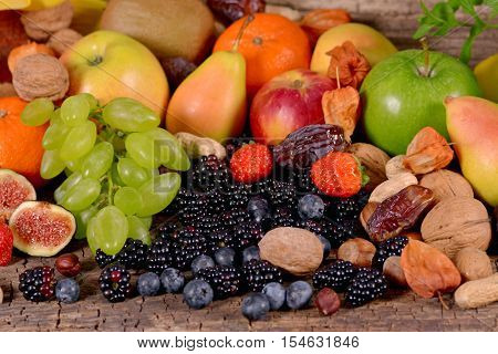 Fruits and berries on a wooden surface