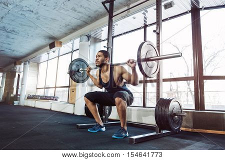Muscular Fitness Man Doing Heavy Deadlift Exercise in the gym