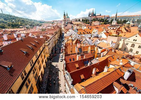Cityscape aerial view on the Lesser town with castle hill and churches in Prague city