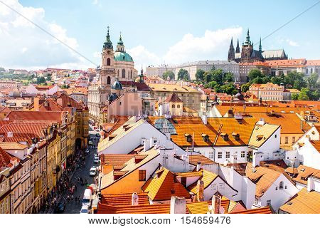 Cityscape aerial view on the Lesser town with castle hill and churches in Prague city