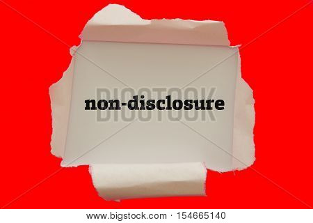 Non-Disclosure word written under torn paper .