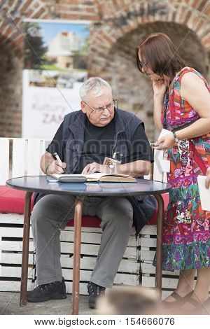 Wroclaw, Poland, June 28, 2014 Andrzej Sapkowski Sign A Witcher Book For The Fan, Authot Of 