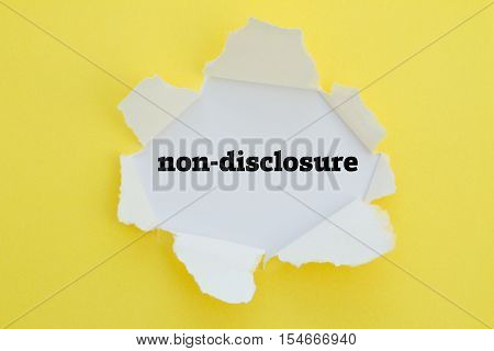 Non-Disclosure word written under torn paper .