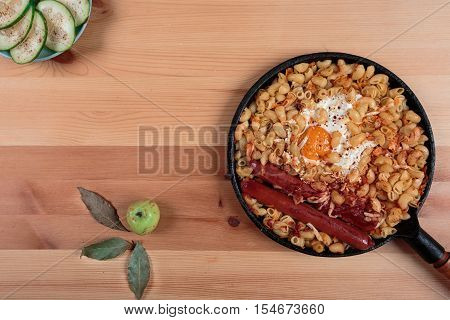 Pasta with egg and green cucumber salad