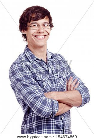 Portrait of young hispanic man wearing glasses and blue shirt with rolled up sleeves standing with crossed arms and smiling isolated on white background